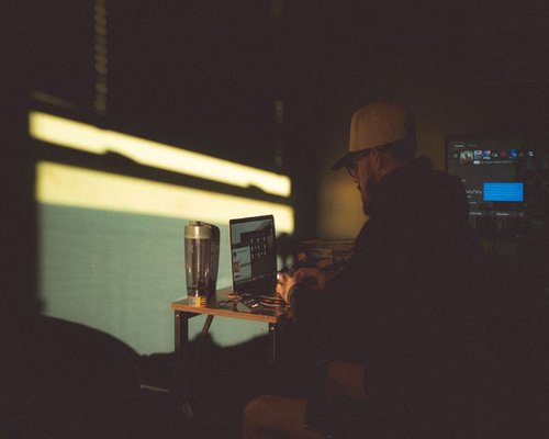 A person working in a well-lit home office with natural light in Mexico